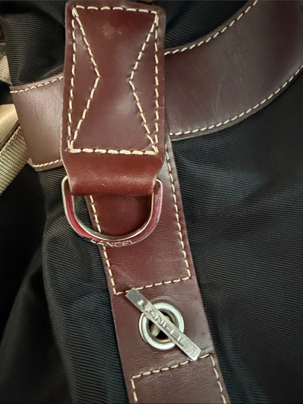 Black Duffel Bag with Tan Handles and Brown Accents